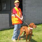 Jaden getting ready to run Mead at hunt test